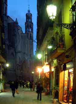 Photograph narrow street L'Argenteria, Santa Maria del Mar church in background
