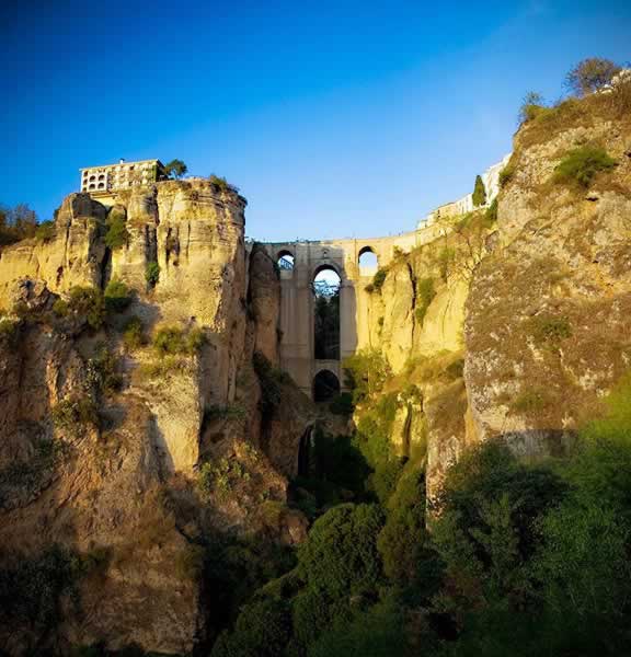 The New Bridge in Ronda taken in dramatic evening light as the Sun sets
